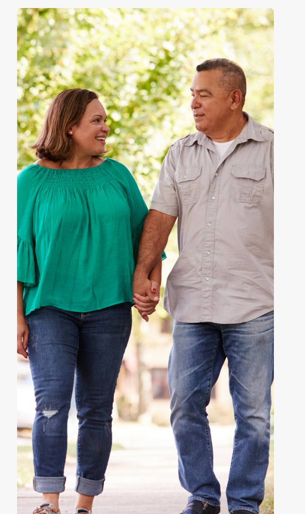 A couple walking together, holding hands